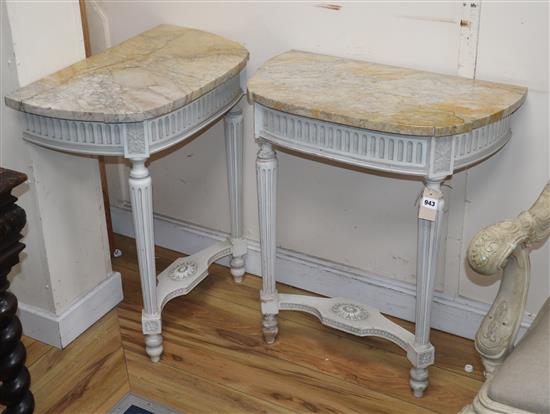 A pair of painted console tables with marble tops W.62cm